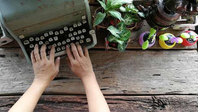typewriter on old wood table 