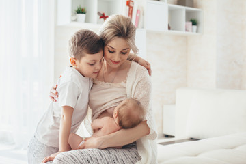 Fototapeta na wymiar Mom breast feeding baby