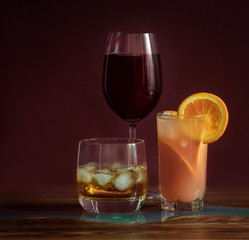 Alcohol drinks on dark solid background 