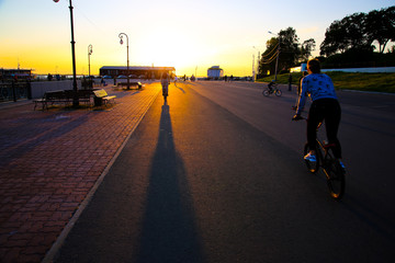 Obraz premium young people riding a bike