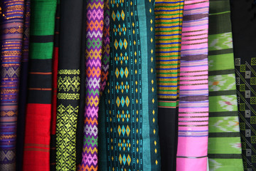 Traditional womans clothing made of colourful silk fabric with different fabrics, Yangon, Myanmar.