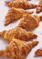 freshly baked croissants on tray, top view