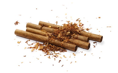 Cigarillos and tobacco pile isolated over white background