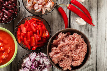 Ingredients ready for preparing chili con carne. Mincemeat, papr