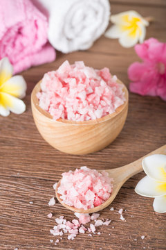 Pink Spa Salt In Wooden Bowl With Orchid Flower And Towel.