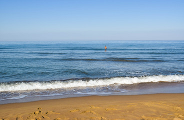 The  man in a calm sea.