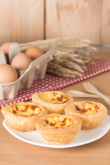 Egg tart on wood table.