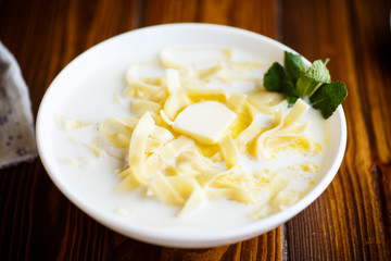 Milk sweet soup with homemade noodles