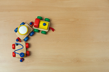 Obraz premium Wooden train toy on floor.