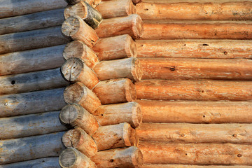 Corner of a wooden blockhouse and its walls in ancient Russian style