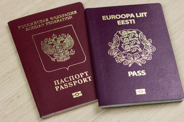 two passports on the table. dual citizenship of Estonia and russia, europe