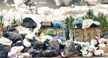 Big rubbish dump near the road. Disposal, deterioration and pollution concept