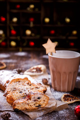  Christmas  Holidays Concept Dresdnen Stollen 
 with raisins on the Wooden Background Gift for Christmas Fruit Cake for the Holiday German, European festive dessert Tradition of Decoration