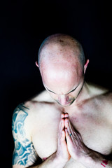 Naklejka premium Muscular man performs Yoga and meditation