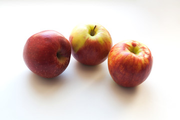 Fototapeta na wymiar Three ripe red apples isolated on white background