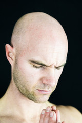 Naklejka premium Muscular man performs Yoga and meditation