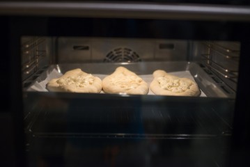 Baking traditional khachapuri.