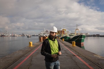 Dock worker using digital tablet