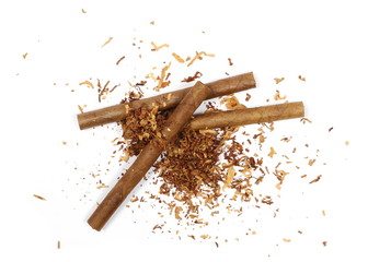 Cigarillos and tobacco pile isolated over white background, top view