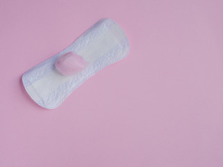Panty liner on pink background with pink cotton