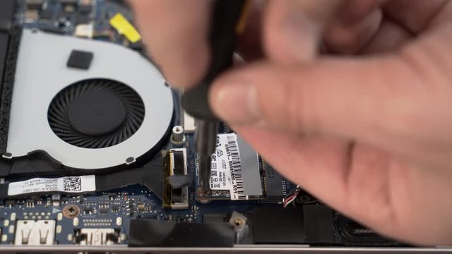 Laptop repair. Replacing the hard drive on the laptop.