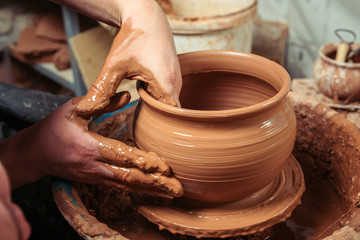 Potter at work. Workshop place.