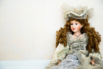 Doll and flowers on a white background. Free space.