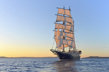 Obraz na płótnie Canvas Luxury yacht sailing at sunset. Yachting. Sailing