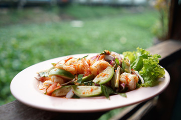 Spicy Green Eggplant Salad with Prawns with green background