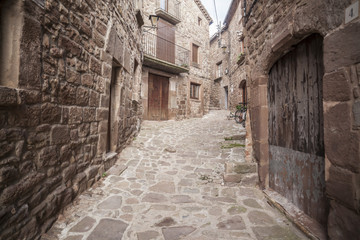Fototapeta premium Street village, stone pavement and walls in L Estany,moianes region comarca, province Barcelona,Catalonia.