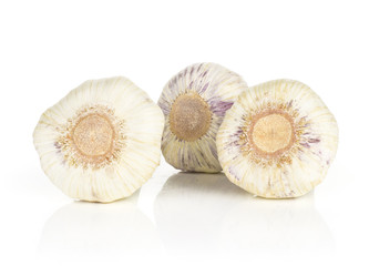 Three young garlic bulbs isolated on white background.