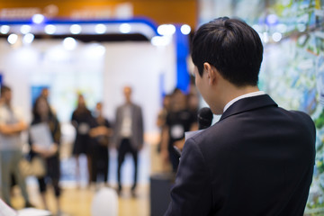 Man in Suit Giving Business Presentation