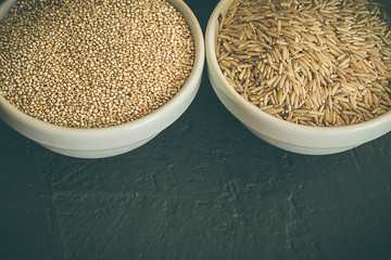 Wild raw brown rice and raw quinoa in a bowl. Healthy whole food.