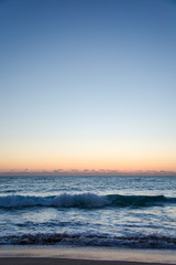 Florida Coast Beach View with Blue and Orange Sky at Sunrise or Sunset