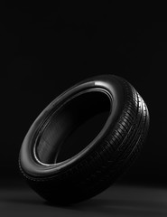 New car tire on black background