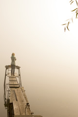 travel meditation reflection thought woman wooden bridge river sunrise fog