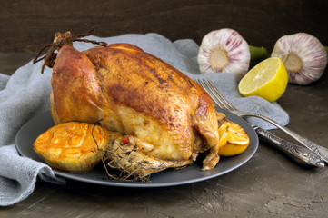 Whole chicken fried with garlic and thyme.