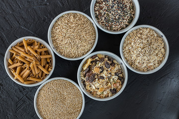 Quinoa, brown rice, seeds and oats . Whole grain and organic food concept for vegetarians