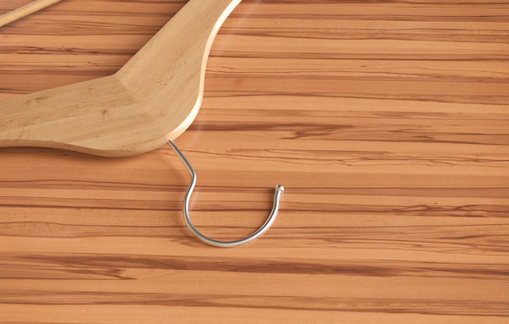 Wooden clothes hanger on table - 3D Rendering