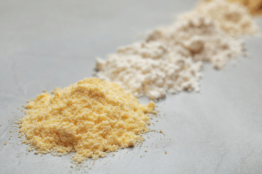 Pile of corn flour on table, closeup