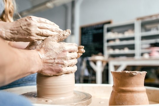 Man and pregnant girl molded ceramic vase