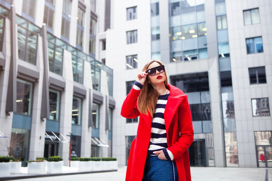 Young charming woman in fashionable sunglasses looking away.Street fashion concept.