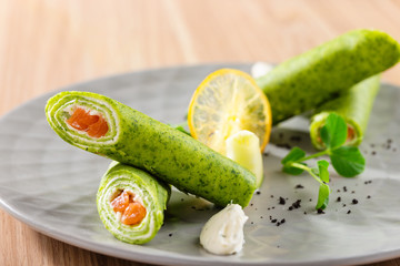  spinach crepes or pancakes with cream cheese and salmon