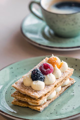 Beautifully decorated cream slice on plate at a bakery shop in Minsk, Belarus.