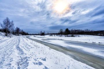 Fototapeta na wymiar Winter landscape with a frozen river