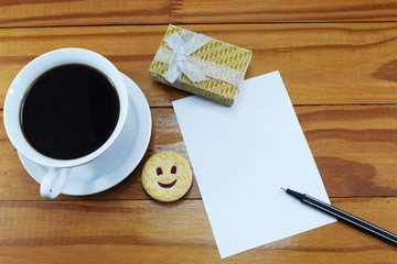 morning black coffee with cheerful smiling cookies, and with a place for congratulations