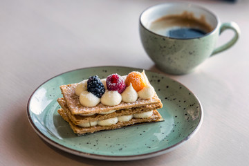 Beautifully decorated cream slice on plate at a bakery shop in Minsk, Belarus.