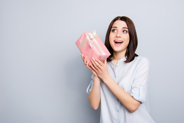 Style short bob hair brunette face feelings model xmas new year people person concept. Portrait of beautiful cute lovely tender businesswoman getting present isolated on gray background copy-space