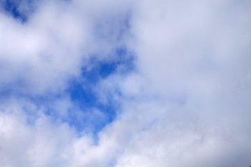 texture of clouds with a large cloud and blue on the left side