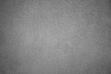 The texture of a concrete wall with a shallow texture of gray color